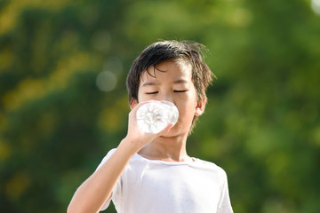 Young boy drink a water