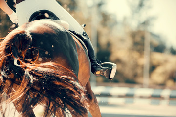 The fluttering tail of a red galloping horse. Overcome obstacles.