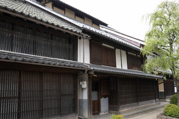 Fototapeta na wymiar Old house with small roof in Unno Station on Hokkoku Road in Tomi City, Nagano Prefecture