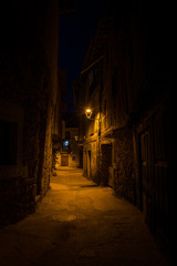 Streets of the village of San Martín del Castañar illuminated at night, Salamanca, Spain