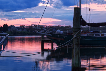 Beautiful Sail Boat with Bright Pink and Blue Sunset in the Background at a Marina in Colonial Beach Virginia