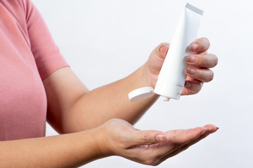 Asian women wash hands with alcohol gel isolated on white background, wear sanitary masks and have hand washing gels in new normal