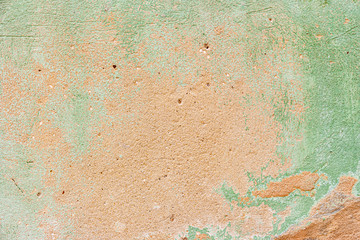 Old wall with peeling paint green