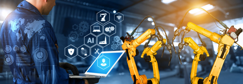 Smart industry robot arms for digital factory production technology showing automation manufacturing process of the Industry 4.0 or 4th industrial revolution and IOT software to control operation .