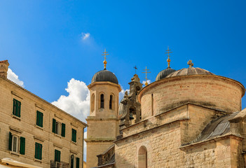 Stone walls and domes of Church of Saint Luke and Saint Nicholas church in the medieval Old Town of Kotor, Montenegro