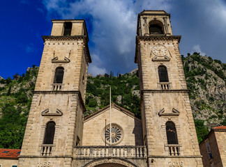 Fototapeta na wymiar Stone walls and domes of Church of Saint Luke and Saint Nicholas church in the medieval Old Town of Kotor, Montenegro