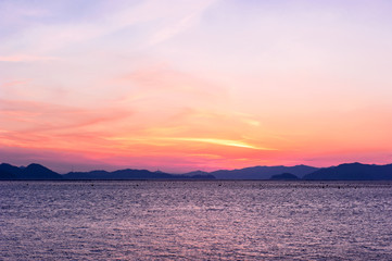 Fototapeta na wymiar Beautiful seascape of sunset background orange color sky.