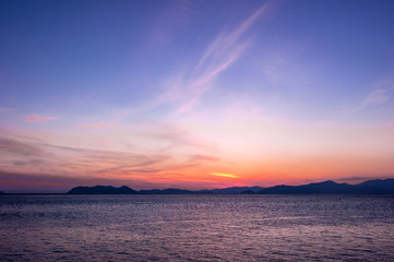 Fototapeta na wymiar The fantastic sunset island and orange color sky.