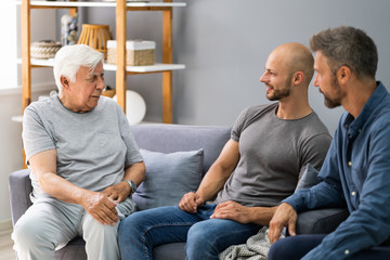 Fototapeta premium Grandpa Talking With Grandson And Son