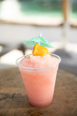 A frozen margarita poolside at a resort