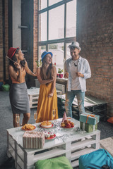 Three friends hanging out at the party