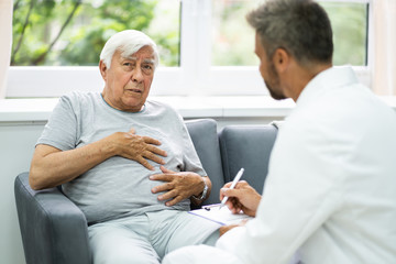 Home Care Elder Patient Talking To Doctor