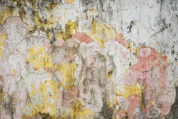 Colorful ancient crumbling plaster wall abstract horizontal background texture