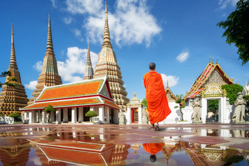 Buddhism Monk walk in Pho temple in Bangkok city