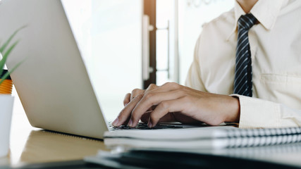 businessman analyzing statistics on laptop screen, working with financial graphs charts online, using business software for data analysis and project management concept