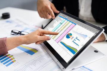 Analyst Employee Working On Spreadsheet