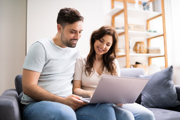 Fototapeta premium Couple Shopping Online. Woman Buying