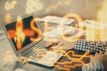 Double exposure of seo icon with man working on computer on background. Concept of search engine...