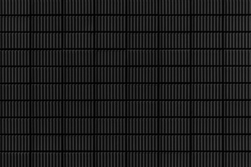 Modern black stone wall with stripes texture and seamless background