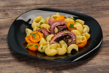Pasta with octopus and yellow tomatoes