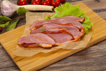Sliced smoked duck breast served salad