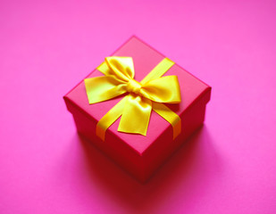 gift box with bow on pink background