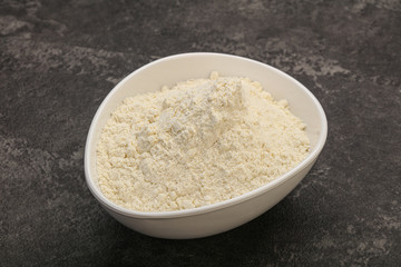 Wheat flour heap in the bowl