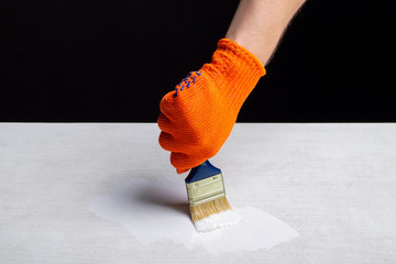 painting with white paint with a brush