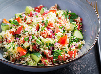 Tabbouleh salad. Traditional middle eastern or arab dish. Levantine vegetarian salad with parsley, mint, bulgur, tomato.