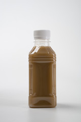 coffee product mockup on plastic bottle over white background