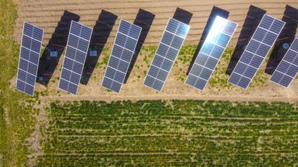 Farm solar sub station. Rotating solar panels at the rural area. Small electric station for covering personal needs.