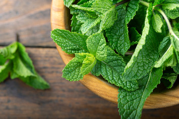 Green fresh mint on the wooden table. © alexshyripa