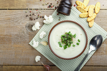 Vegetarian white soup cream of cauliflower. Vegetarian healthy food concept. Top view.
