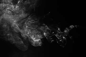Abstract smoke moves on a black background. Design element. Abstract texture.
