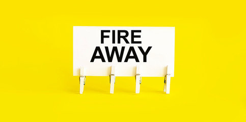 FIRE AWAY , written on white sticky note on yellow background