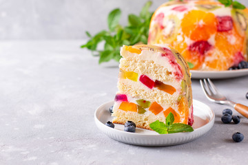 A piece of fruit and jelly cake. Copy space.