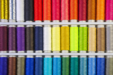 Full frame, colour sewing threads background