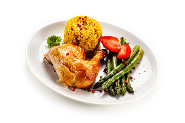Deep fried chicken drumsticks with rice and asparagus on white background
