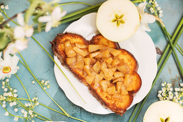 Sandwich with apples and white flowers around
