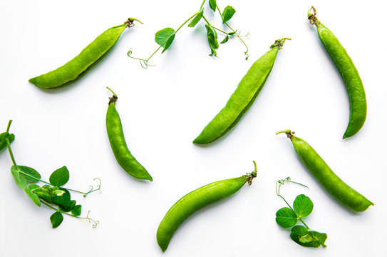 Green peas  on a white  background.  Healthy food background.