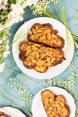 Two baked sandwiches with apples and flowers