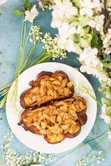 Two sandwiches with apples and flowers