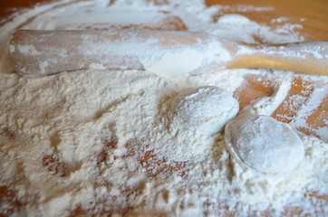 making homemade dumplings with your hands. The table is in flour.