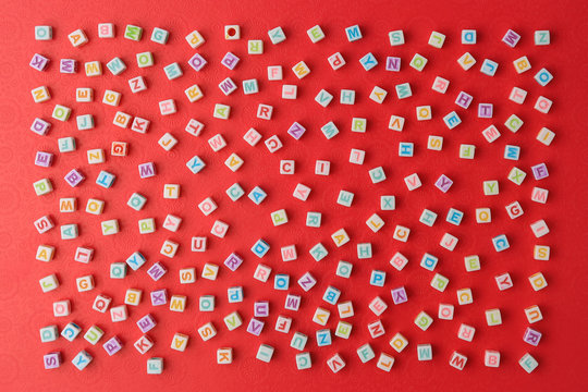 Chaotically scattered cubes with letters conceptual background.