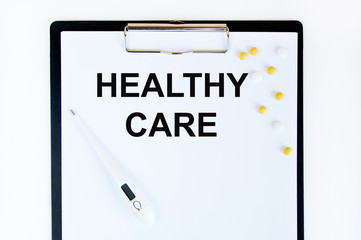 Healthy CARE, a dressing-up and yellow tablets are on the letter tablet.