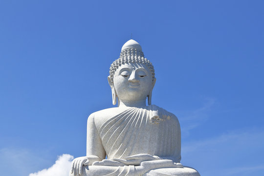 isolated picture of  big buddha set against bright blue sky