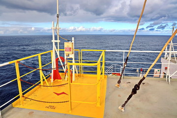 Ship structures, masts, antennas, funnel, ship wheelhouse against the blue sky and clouds. Vessel traveling at ocean. © masterskuz55