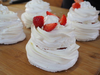 the chef decorates the dessert with fresh raspberries and strawberries. Anna Pavlovna's dessert