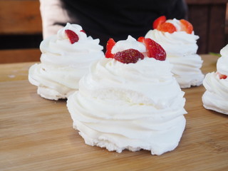 the chef decorates the dessert with fresh raspberries and strawberries. Anna Pavlovna's dessert