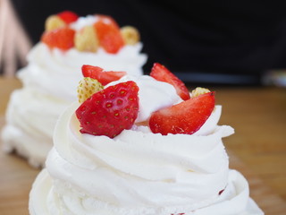 the chef decorates the dessert with fresh raspberries and strawberries. Anna Pavlovna's dessert